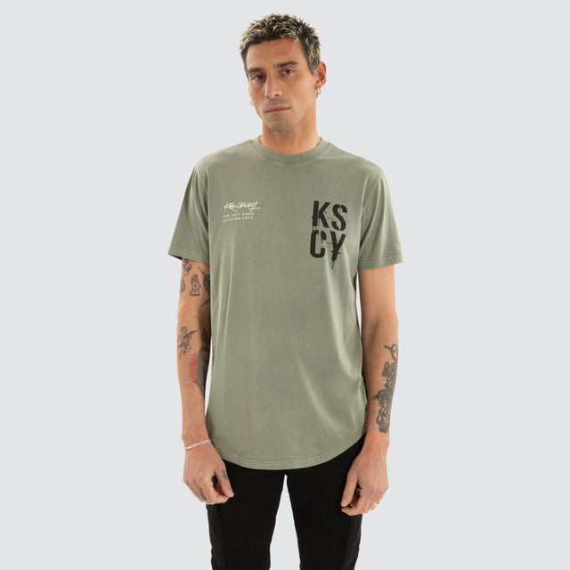 model wears Cloak Dual Curved Tee Pigment shadow T-Shirts Green - image 2