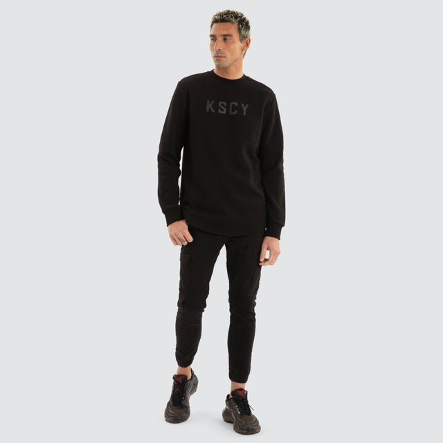 model wears Flicker Dual Curved Sweater Jet Black Jumpers Black - image 2