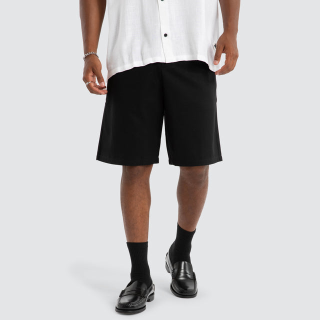model wears Amplify Pleated Short Black Shorts Black - image 1