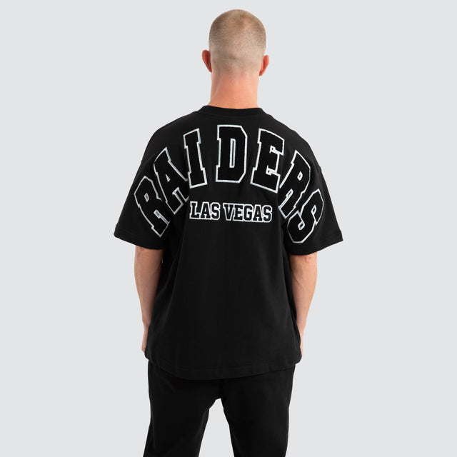 model wears Las Vegas Raiders Surround Loopback Tee Jet Black T-Shirts Black - image 1