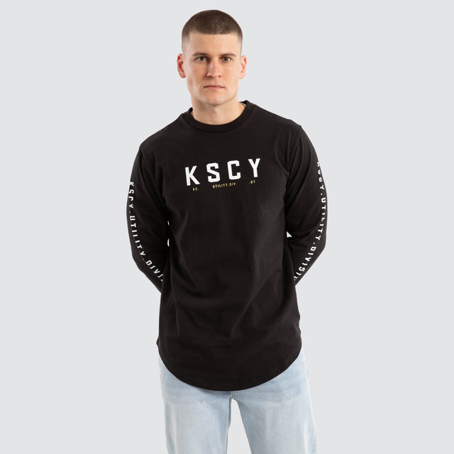 model wears Lancer Dual Curved Longsleeve Tee Jet Black Longsleeve T-Shirts Black - image 2