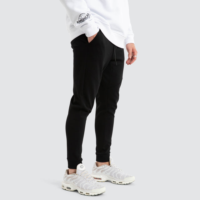 model wears Novas Trackpant Jet Black Trackpants Black - image 4