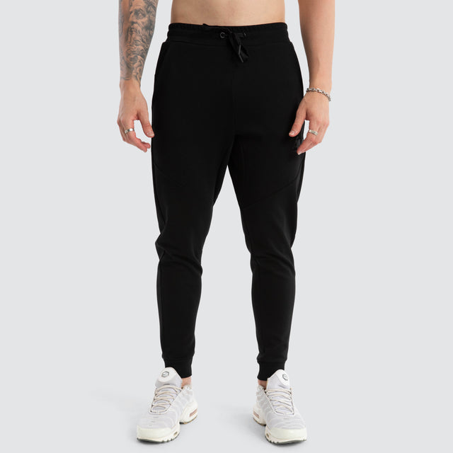 model wears Novas Trackpant Jet Black Trackpants Black - image 6