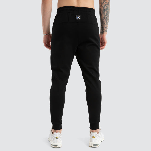 model wears Novas Trackpant Jet Black Trackpants Black - image 7