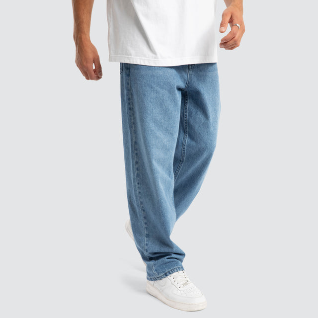 model wears Drive Athletic Baggy Jean Washed Blue Pants Blue - image 1