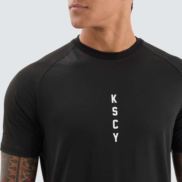 model wears Fortify Raglan Dual Curved Active Tee Black/Asphalt T-Shirts Black - image 3