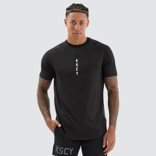 model wears Fortify Raglan Dual Curved Active Tee Black/Asphalt T-Shirts Black - image 2