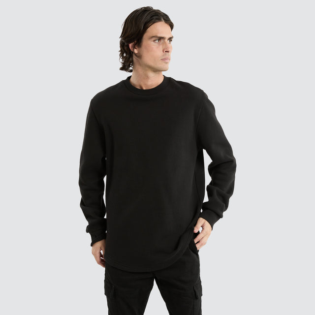 model wears Miles Dual Curved Sweater Jet Black Jumpers Black - image 1