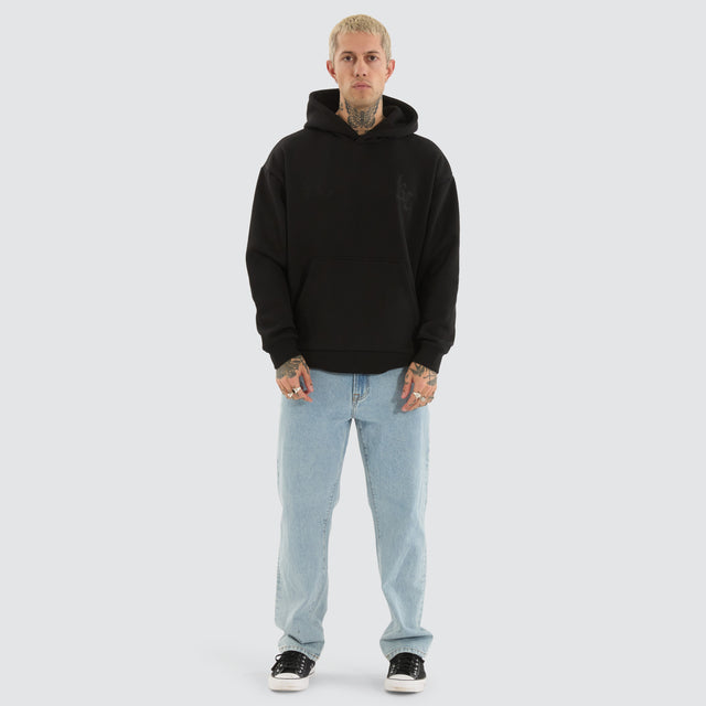 model wears Chained Relaxed Hoodie Jet Black Hoodies Black - image 2