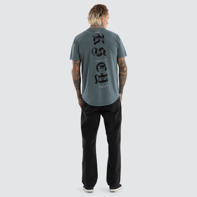 model wears Black Letter Dual Curved Tee Pigment Stormy Weather T-Shirts Blue - image 6