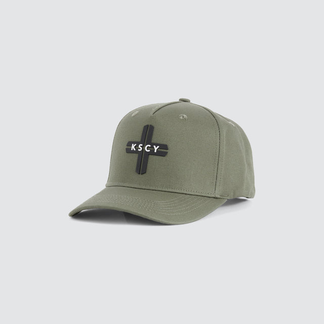 model wears Charon 5 Panel Curved Peak Cap Vetiver Caps Green - image 2