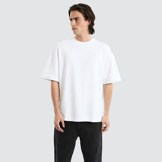 model wears Cassius Loopback Street Tee Optical White T-Shirts White - image 1