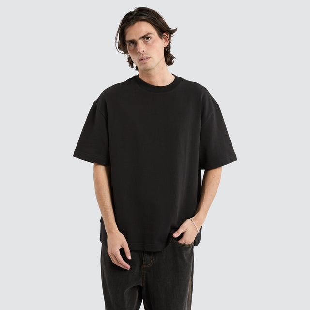 model wears Cassius Loopback Street Tee Jet Black T-Shirts Black - image 1