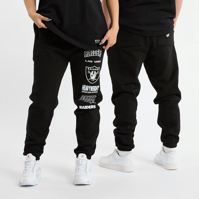 model wears Las Vegas Raiders Kickoff Trackpant Jet Black Trackpants Black - image 1