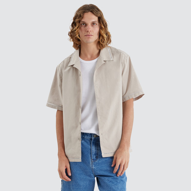 model wears Ladder Resort Crop Shirt Light Taupe Short Sleeve Shirts Tan - image 1