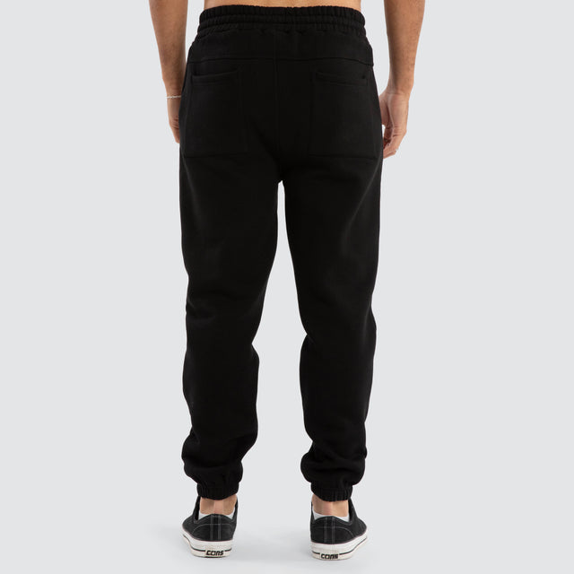model wears Trial Tracksuit Pant Jet Black Trackpants Black - image 5