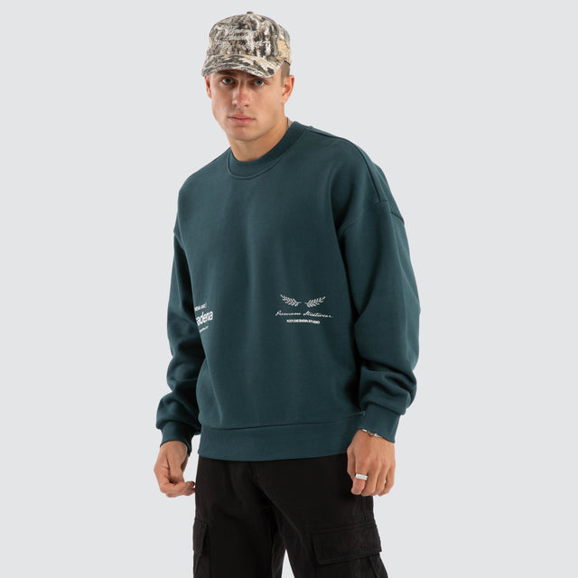 model wears Lectern Box Fit Sweater Sea Moss Jumpers Green - image 4