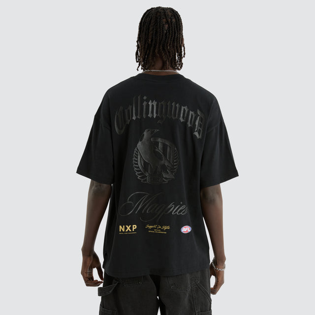 model wears Collingwood Magpies AFL Blacked Out Raptor Tee Anthracite Black T-Shirts Black - image 1