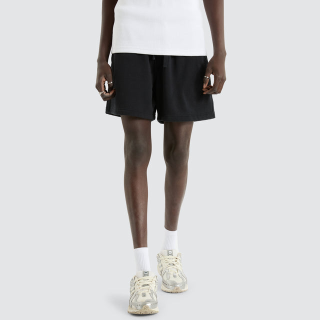 model wears Valle 6 Inch Fleece Short Anthracite Black Shorts Black - image 1