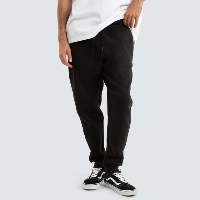 model wears Supply Skinny Trackpant Jet Black Trackpants Black - image 1