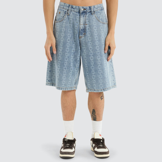 model wears Chain Reaction Slacker Jorts Faded Rinse Indigo Shorts Blue - image 1