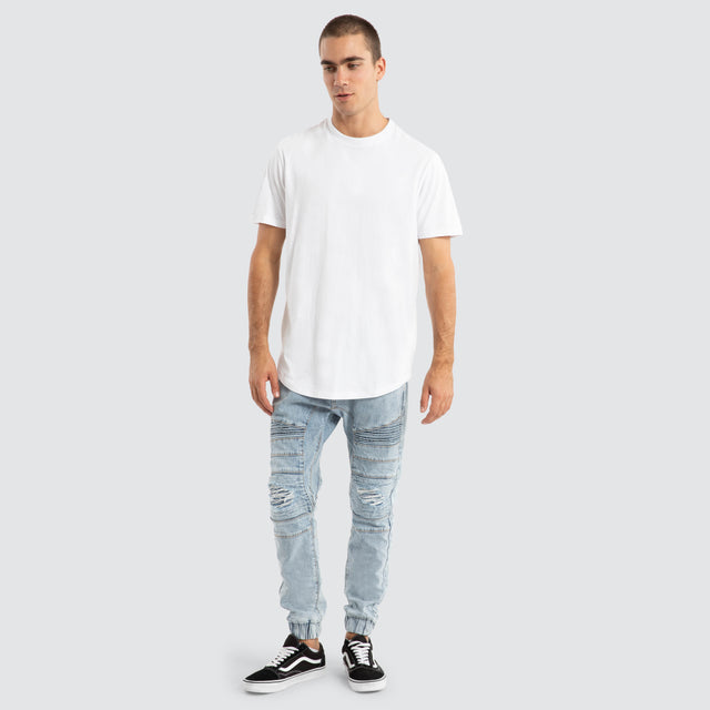 model wears Viper Denim Jogger Portland Blue Pants Blue - image 2