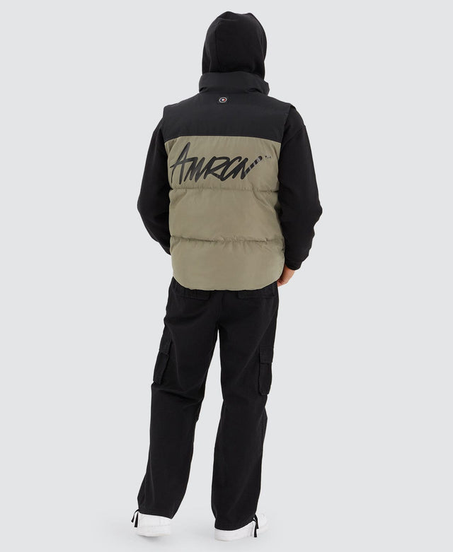 model wears Caldas Puffer Vest Jet Black/Khaki Vests Green - image 5