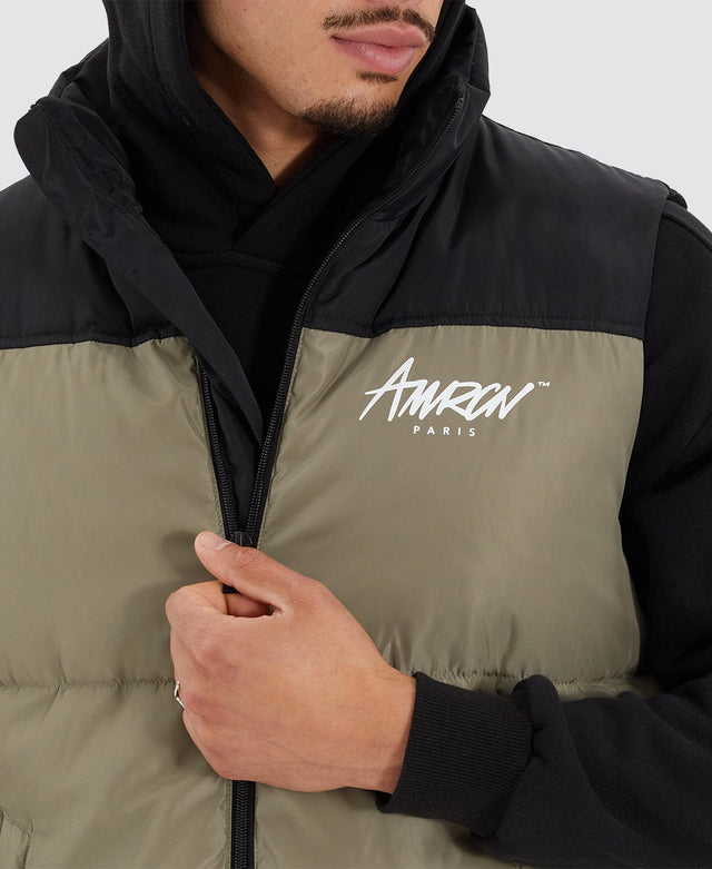 model wears Caldas Puffer Vest Jet Black/Khaki Vests Green - image 6