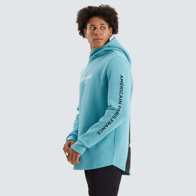 model wears Norge Heavy Dual Curved Hoodie Porcelain Blue Hoodies Blue - image 4