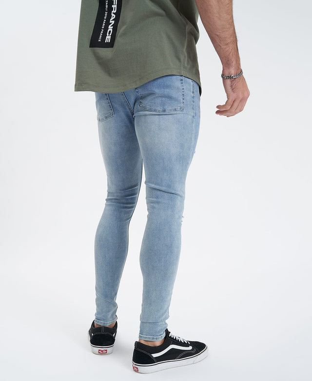 model wears Saint Ultrastretch Jeans Destroyed Bastille Blue Pants Blue - image 8