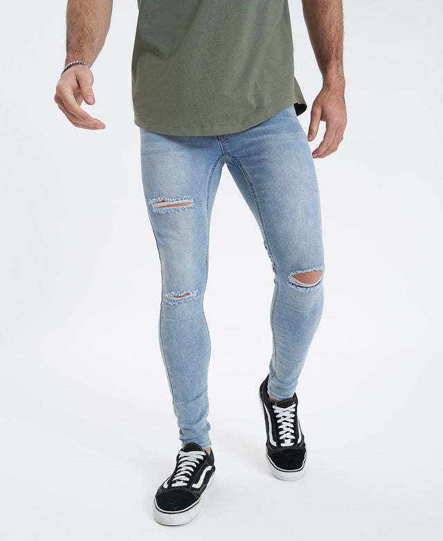 model wears Saint Ultrastretch Jeans Destroyed Bastille Blue Pants Blue - image 7