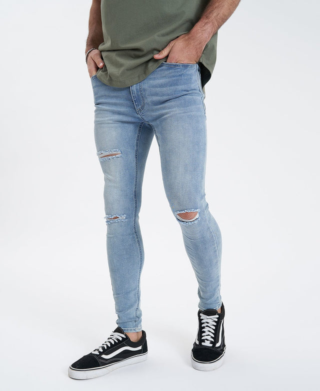 model wears Saint Ultrastretch Jeans Destroyed Bastille Blue Pants Blue - image 1