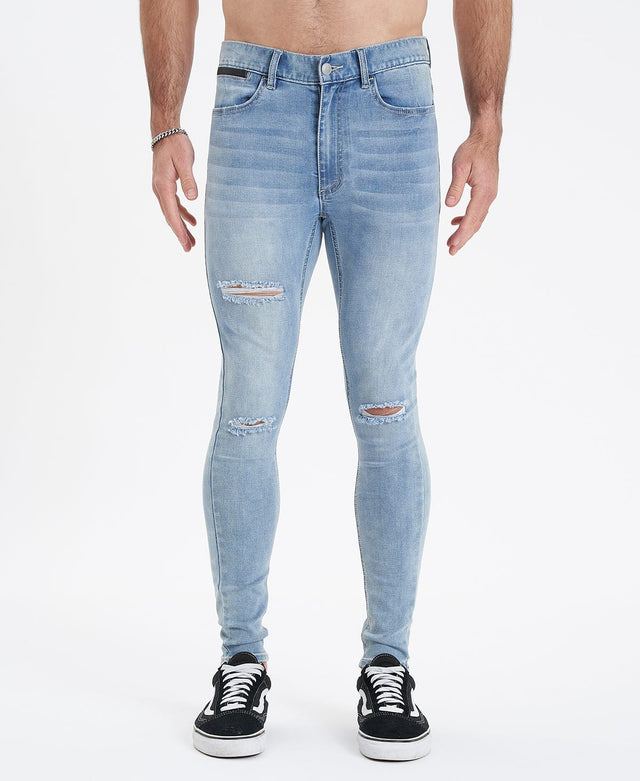 model wears Saint Ultrastretch Jeans Destroyed Bastille Blue Pants Blue - image 3