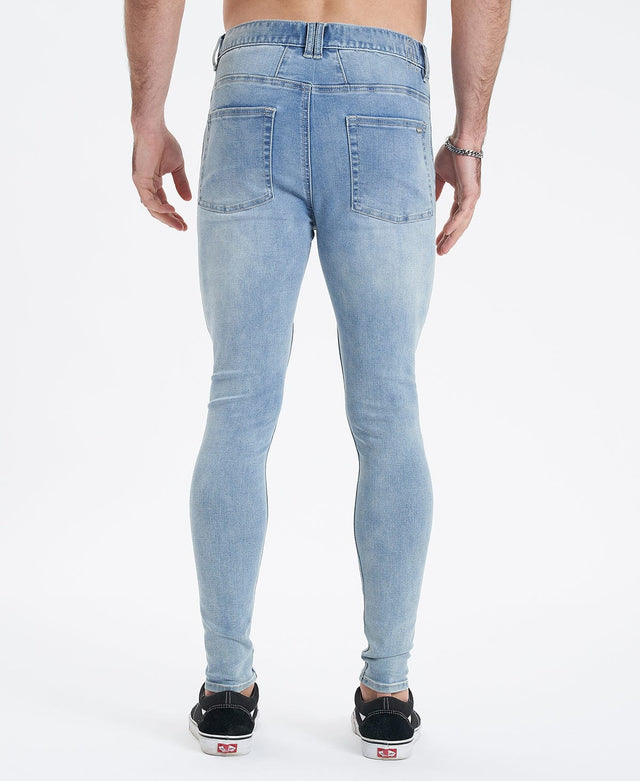 model wears Saint Ultrastretch Jeans Destroyed Bastille Blue Pants Blue - image 4
