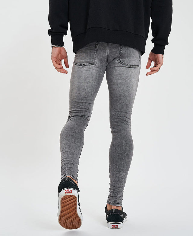 model wears Saint Ultrastretch Jeans Destroyed Gaillon Grey Pants Grey - image 2