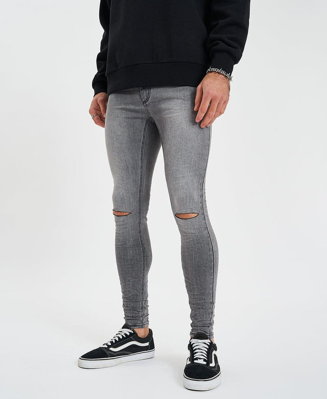 model wears Saint Ultrastretch Jeans Destroyed Gaillon Grey Pants Grey - image 4