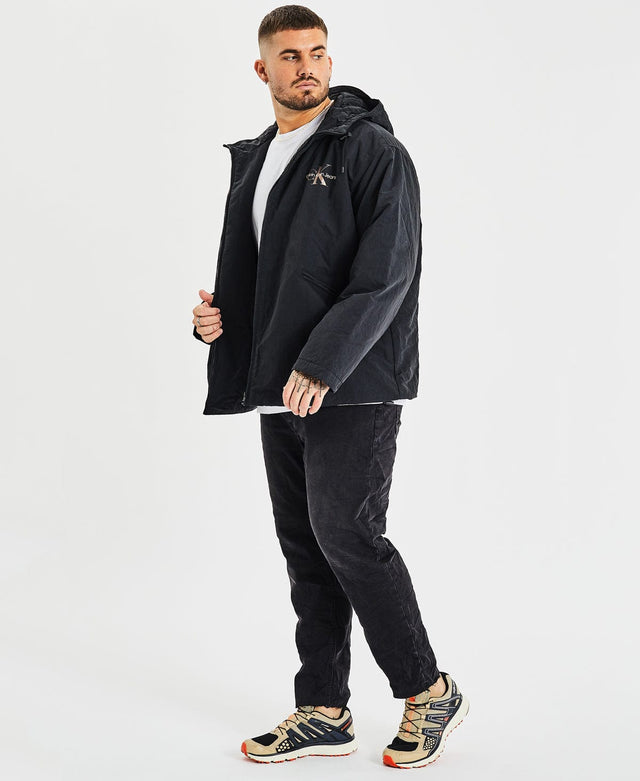 model wears Archival Monologo Windbreaker Jacket Black Outerwear Black - image 3