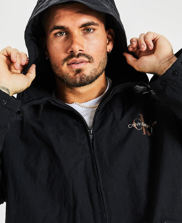 model wears Archival Monologo Windbreaker Jacket Black Outerwear Black - image 4