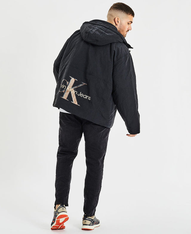 model wears Archival Monologo Windbreaker Jacket Black Outerwear Black - image 6