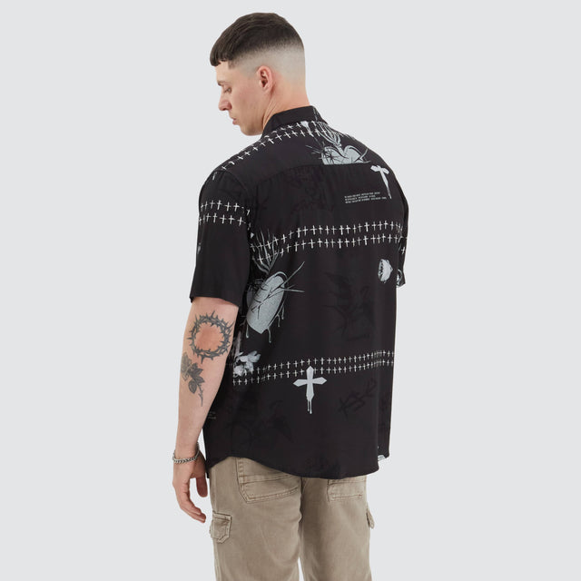model wears Bwindi Relaxed Shirt Dark Rose Print Short Sleeve Shirts Black - image 1