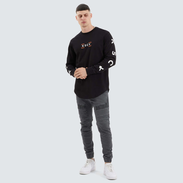 model wears Dassel Dual Curved Longsleeve Tee Jet Black Longsleeve T-Shirts Black - image 4