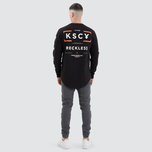model wears Dassel Dual Curved Longsleeve Tee Jet Black Longsleeve T-Shirts Black - image 5