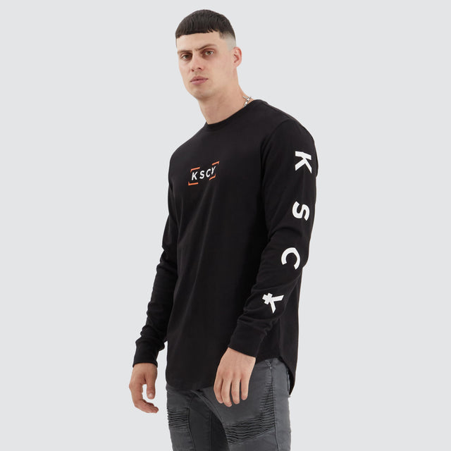 model wears Dassel Dual Curved Longsleeve Tee Jet Black Longsleeve T-Shirts Black - image 2