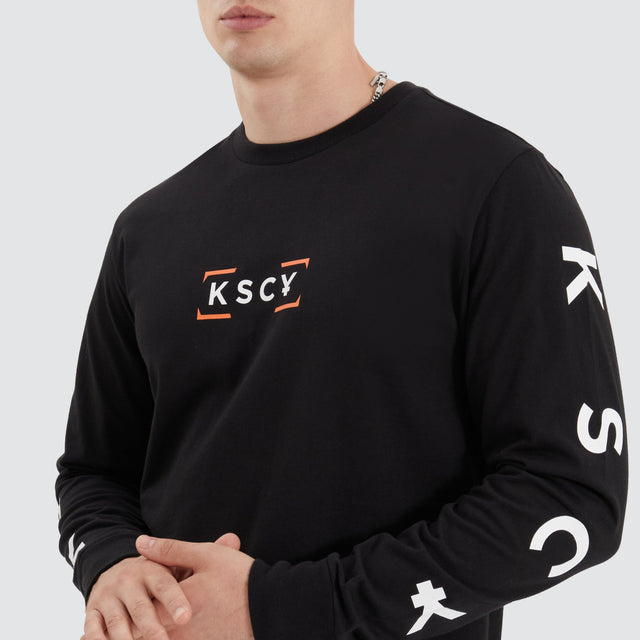model wears Dassel Dual Curved Longsleeve Tee Jet Black Longsleeve T-Shirts Black - image 3