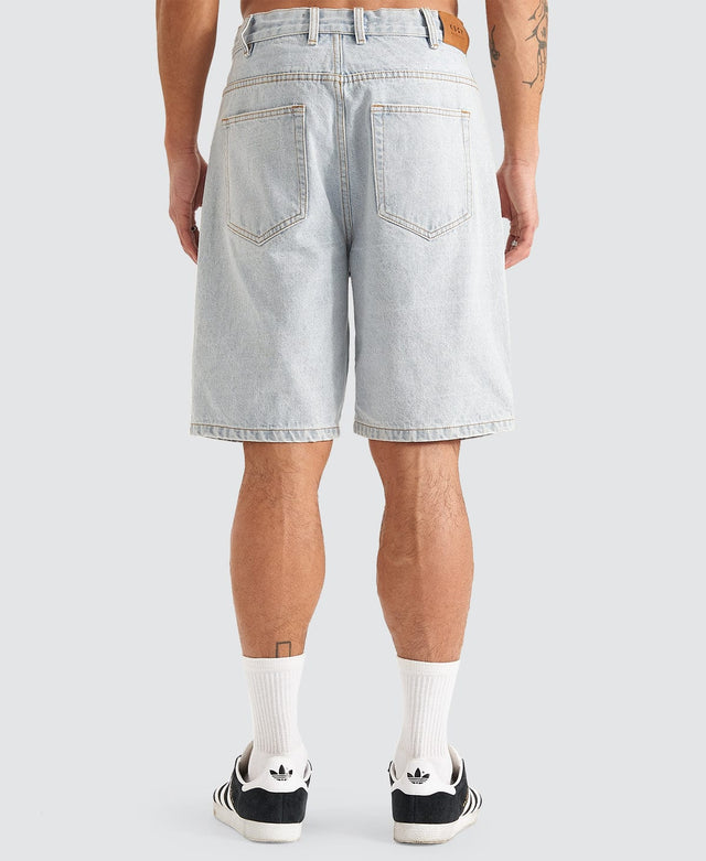 model wears Hyson Baggy Denim Jorts Light Blue Shorts Blue - image 4