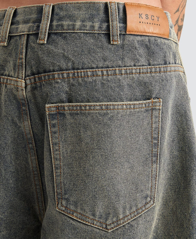 model wears Hyson Baggy Denim Jorts Sandblast Shorts Blue - image 8