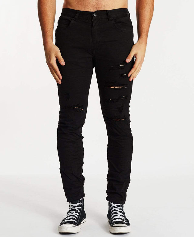 model wears K2 Skinny Jean Destroyed Black Pants Black - image 2