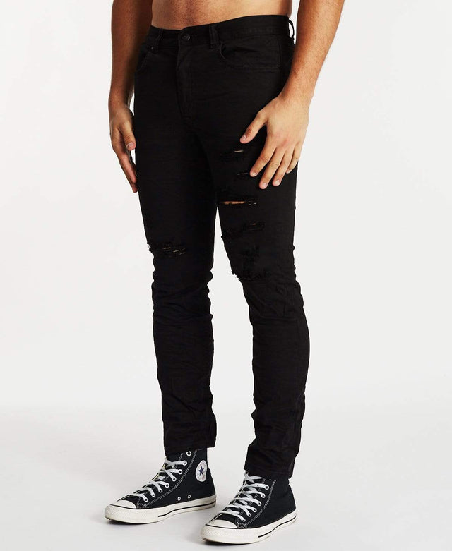 model wears K2 Skinny Jean Destroyed Black Pants Black - image 4