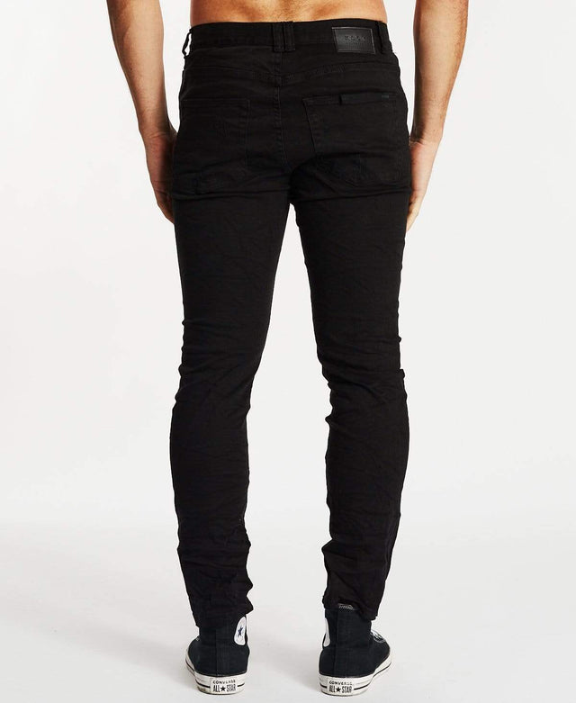 model wears K2 Skinny Jean Destroyed Black Pants Black - image 5