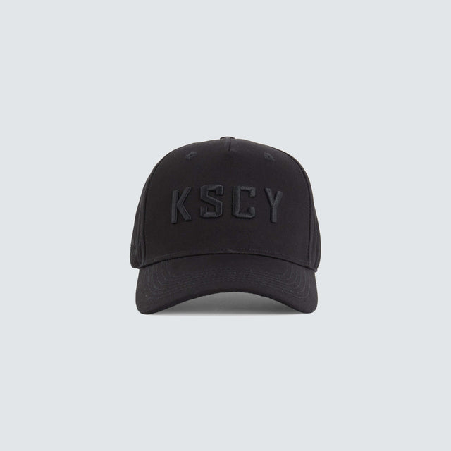 model wears Winsted 5 Panel Curved Peak Cap Black Headwear Black - image 1